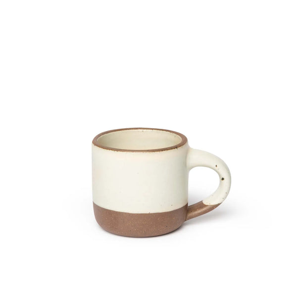 Ceramic mug with a two-tone design on a white background
